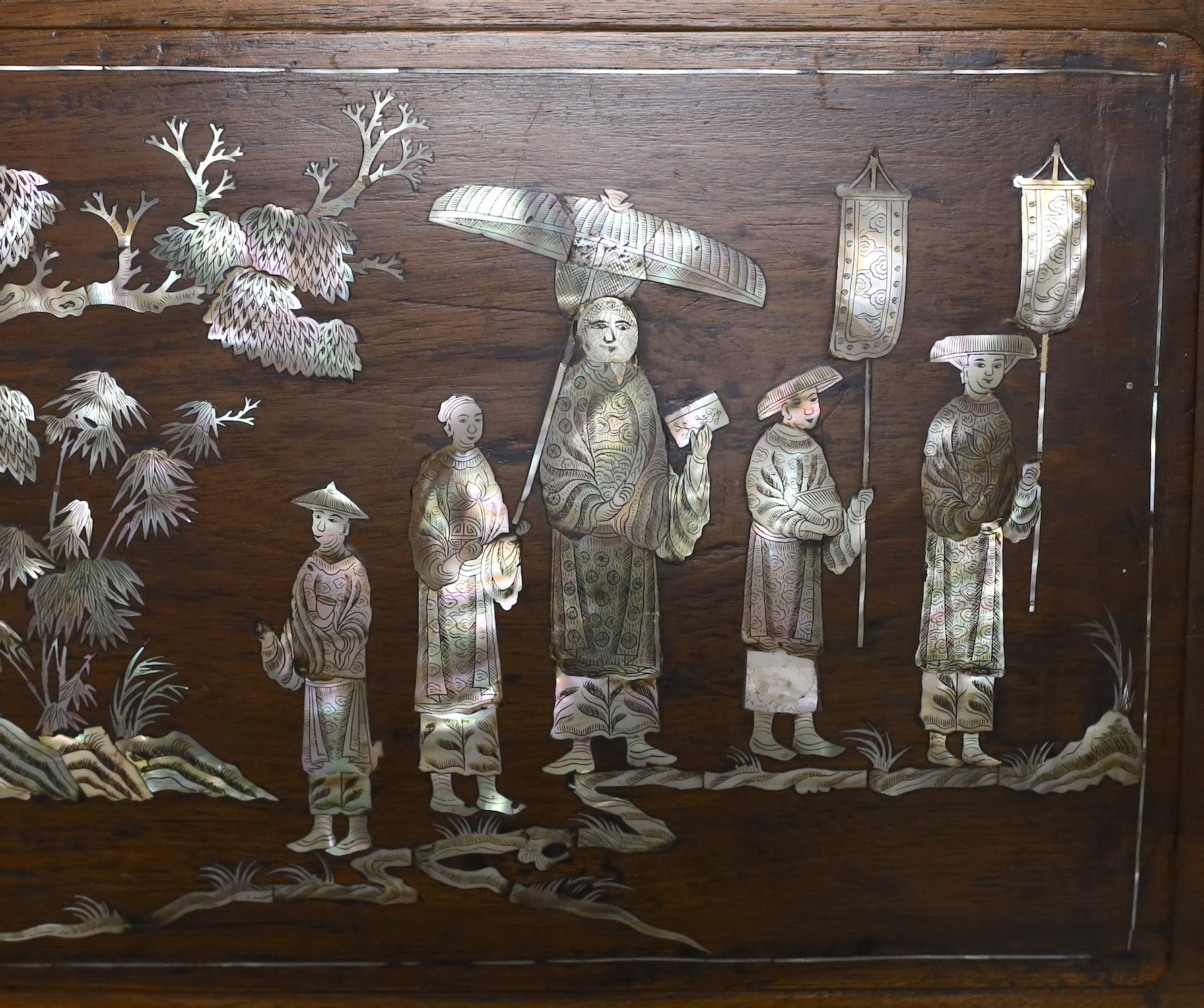 A Chinese hardwood mother-of-pearl inlaid wall hanging, 48cms wide, 33cms high